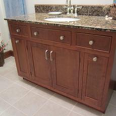 Cherry Bathroom vanity - Includes pull out storage with shelving.